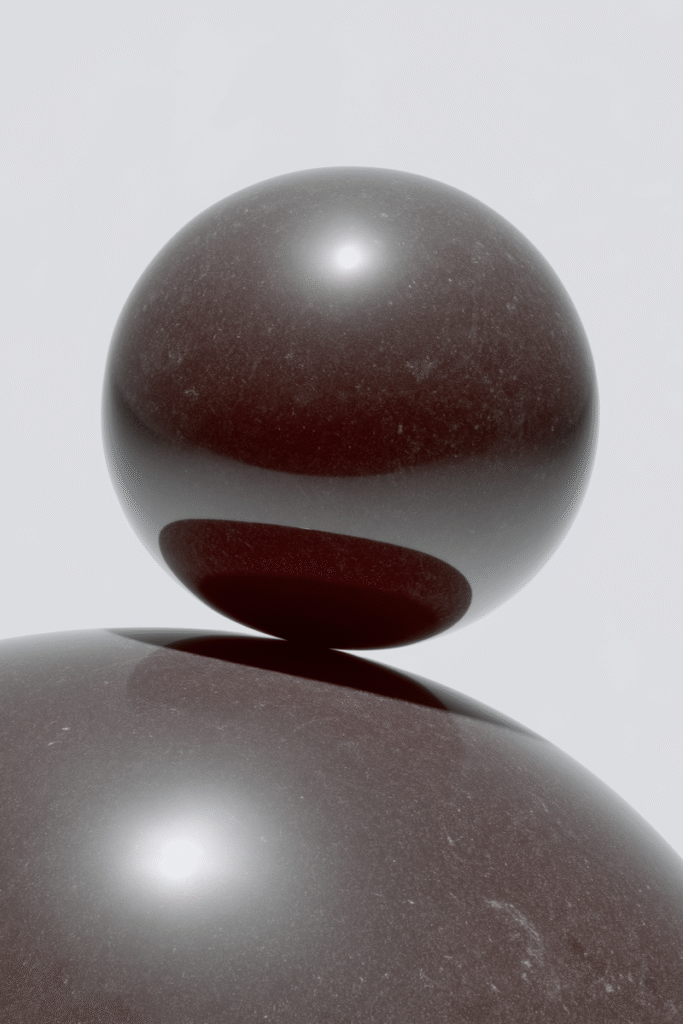 Two spheres representing balance and strategy in online business marketing